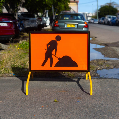 Warning: Workmen Ahead Sign